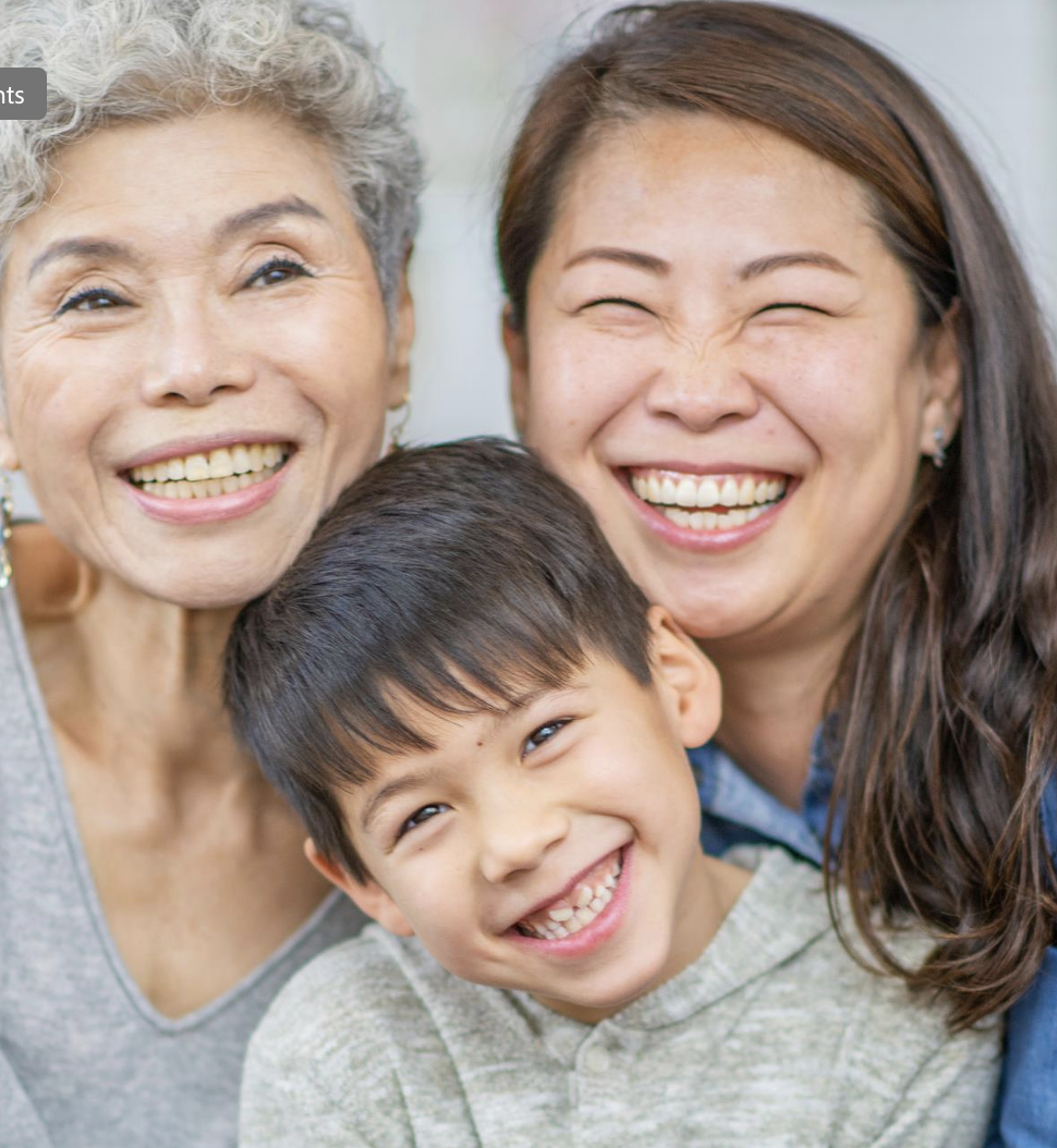 Pictured:  An asian family with grandmother, mother, and child, all smiling