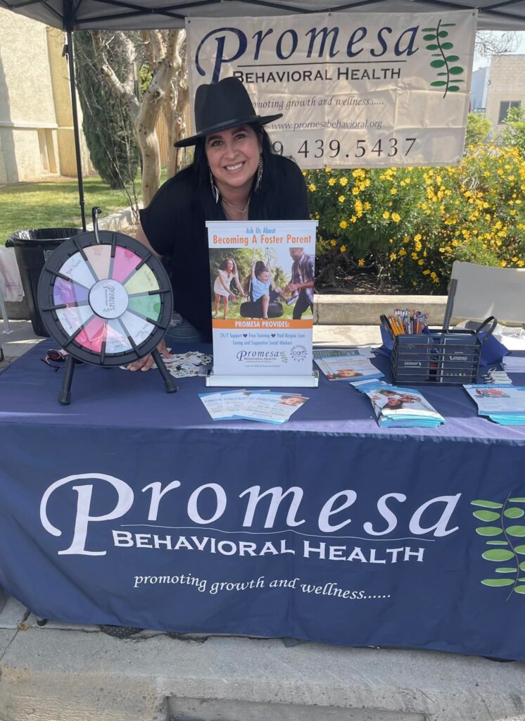 Woman at Promesa Behavioral Health booth