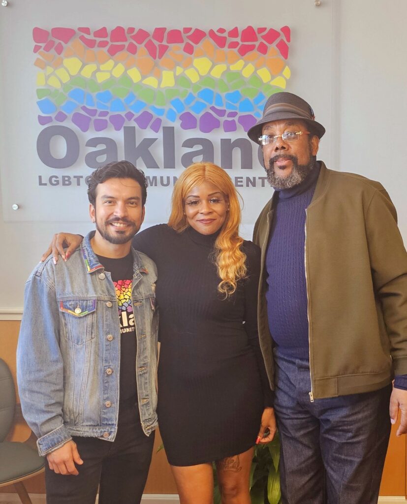 Three people at the Oakland LGBTQ Community Center