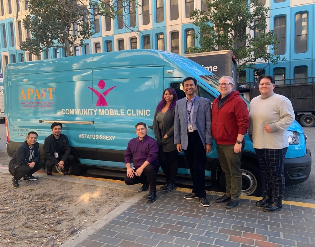 People from Special Service for Groups (SSG) APAIT in front of mobile clinic van