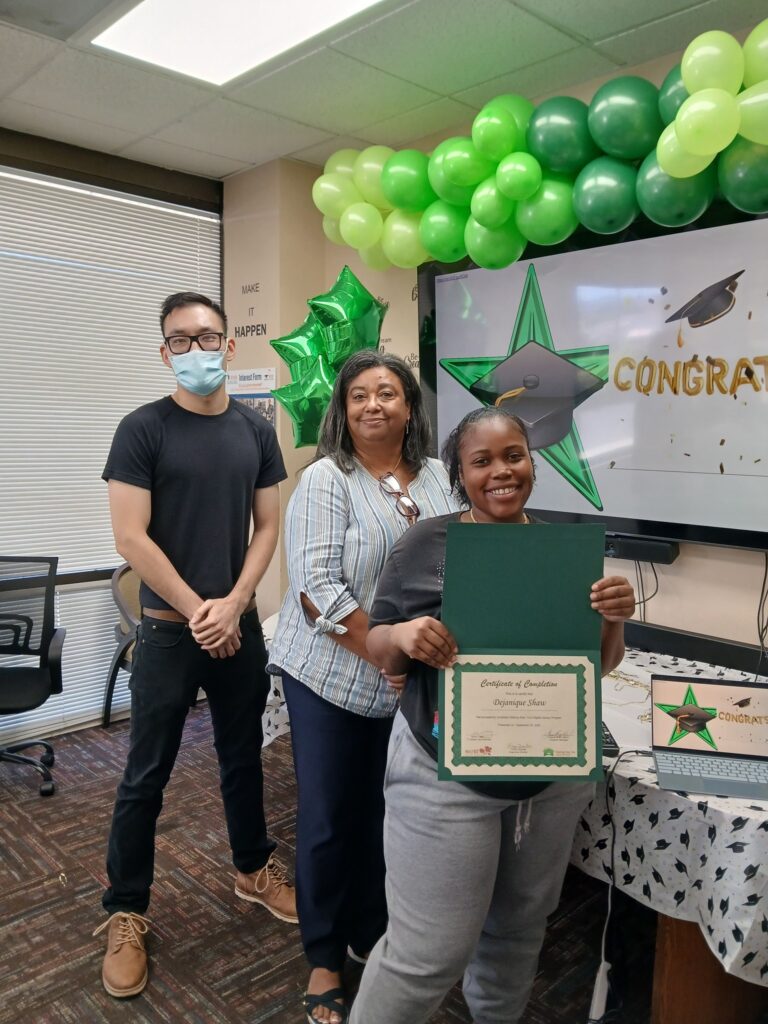 Woman at Starting Over holding certificate