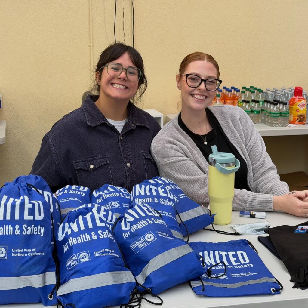 Two United Way of Northern California staff members sitting at table