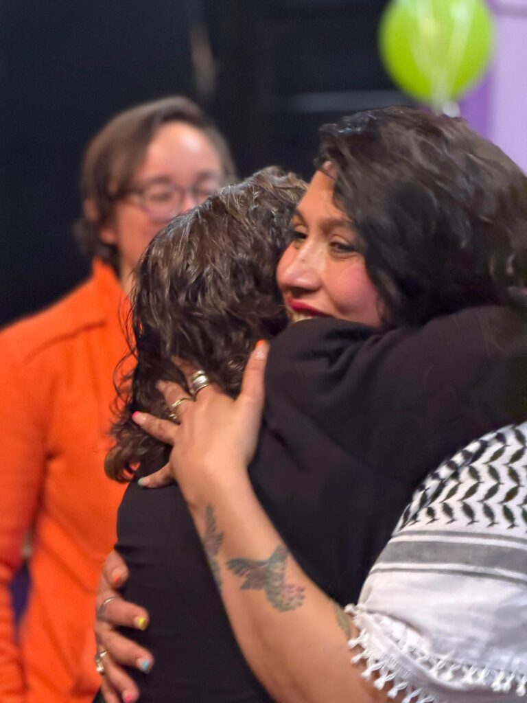 Two joyful woman hugging