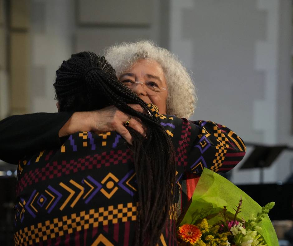 Two woman hugging