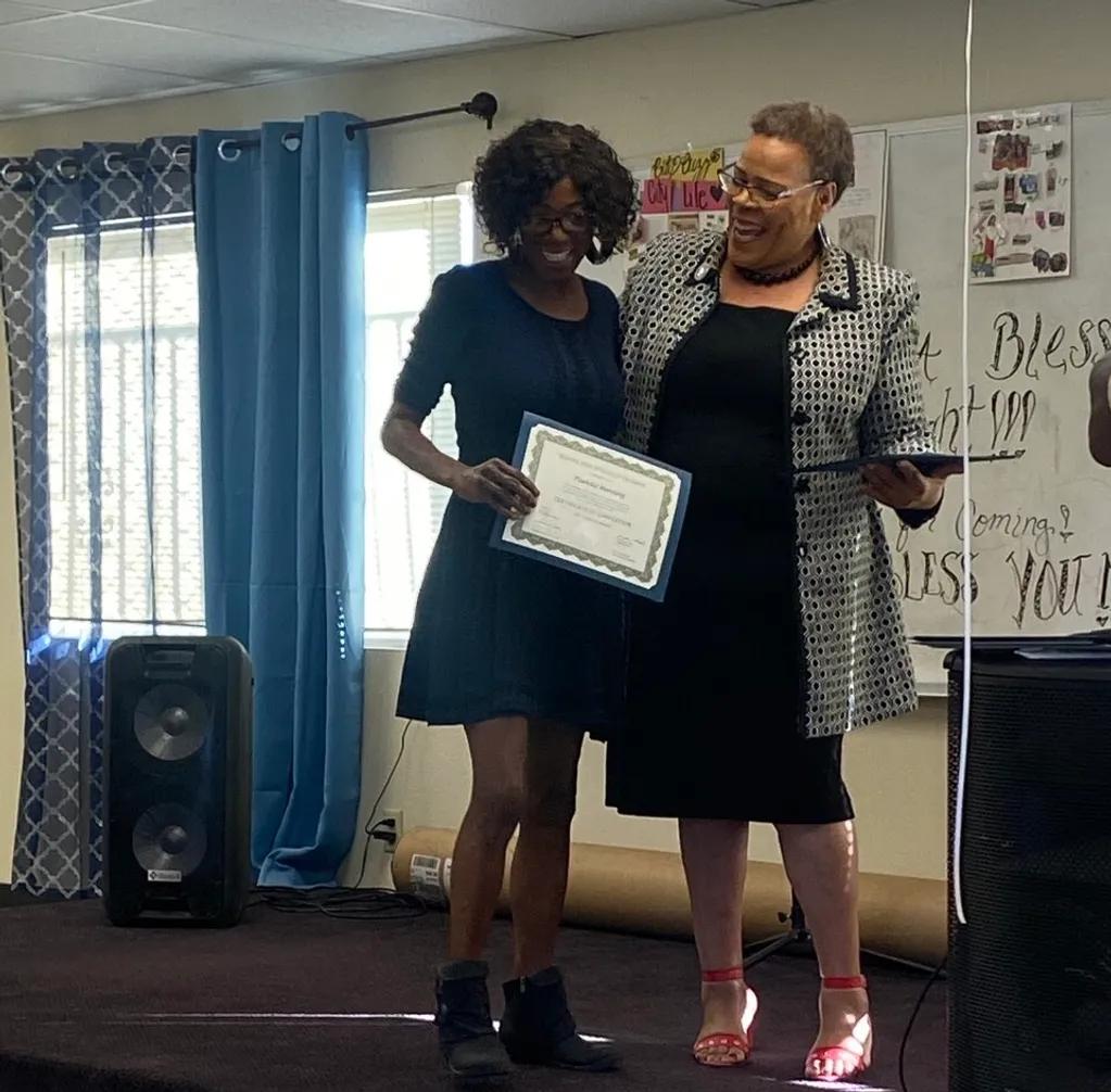 Peer Specialist Paulette Manning receiving her certificate.