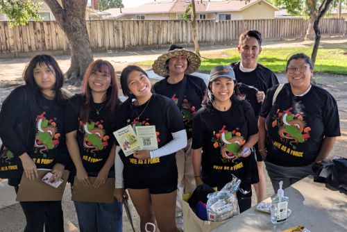 Asian Americans and Pacific Islanders for Civic Empowerment Education Fund members all wearing matching shirts and smiling