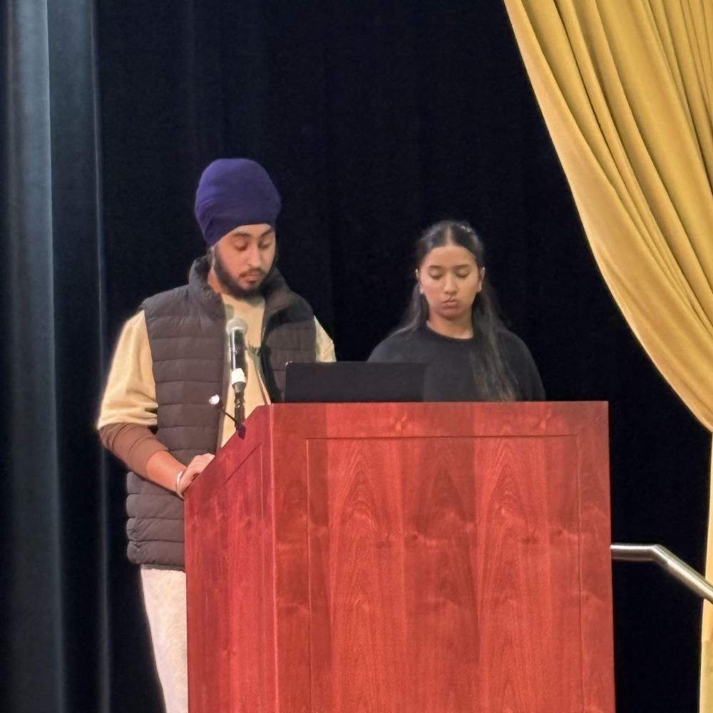 Sikh man and woman giving a speech