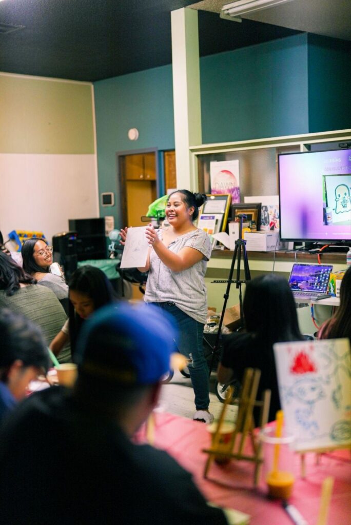 Teenage girl at showcasing her art