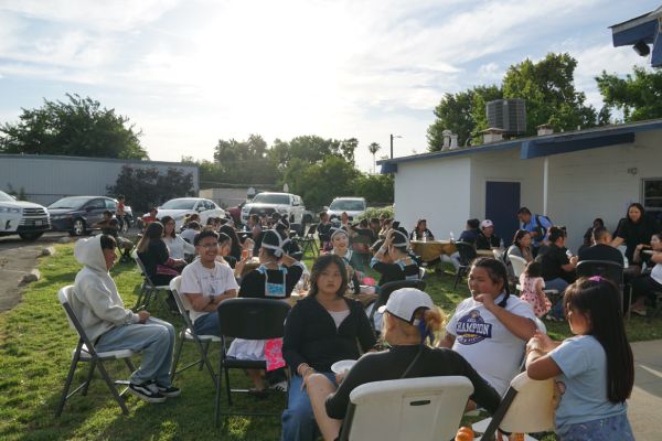 Wide view of a large group of people at a Fresno Immigrant and Refugee Ministries cookout