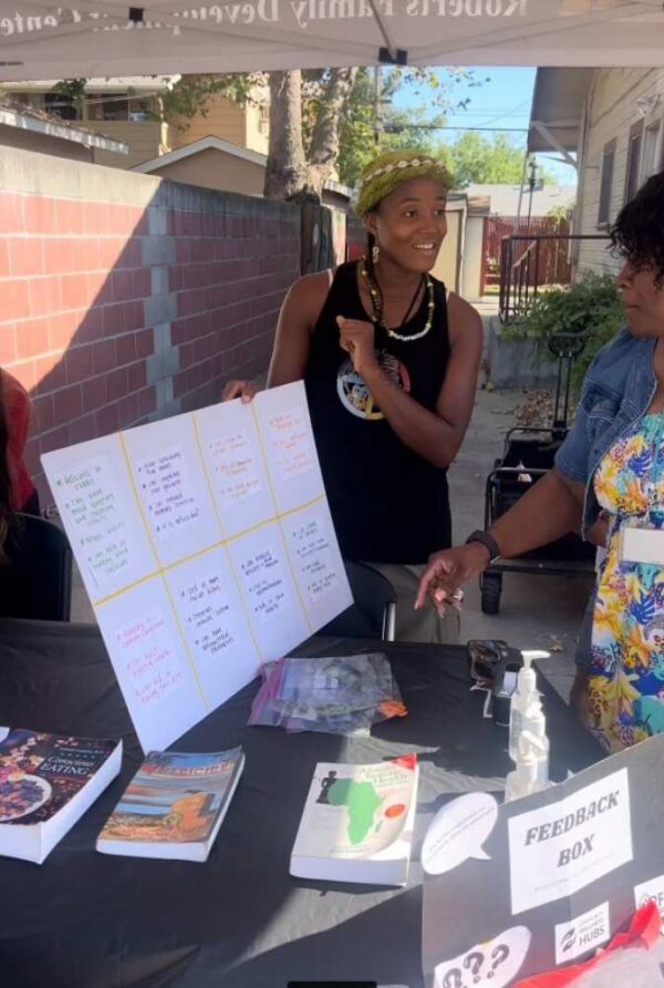 Providing Community with health eating resources at the National Night Out Event in October 2024 at Roberts Family Development Center