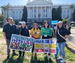 Kaying Hang pictured with community partners at Equity on the Mall